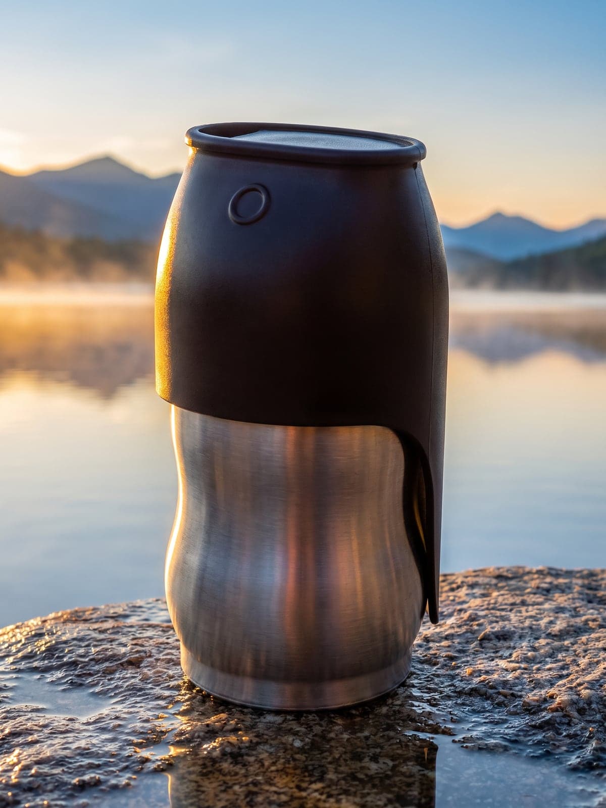 The same flask on wet granite by a misty mountain lake at sunrise. AI-generated · Nano Banana Pro