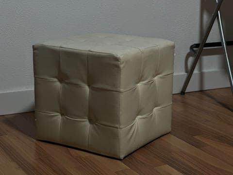 Phone photo: the pouffe on a wooden floor